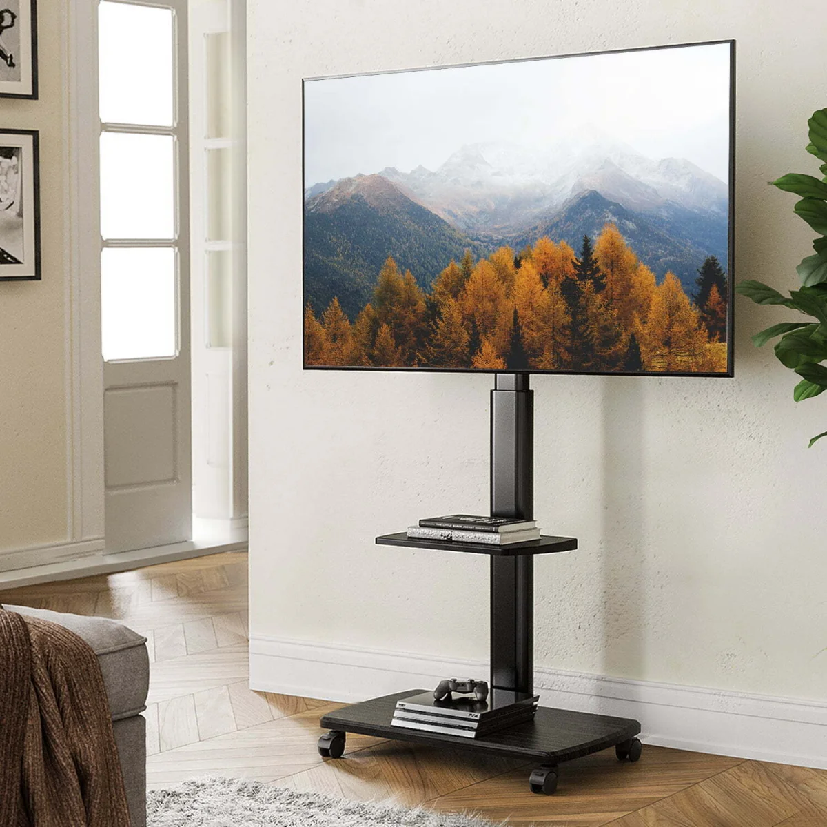 میز تلویزیون ایستاده مشکی چرخ‌دار با قابلیت جابجایی و تنظیم ارتفاع
